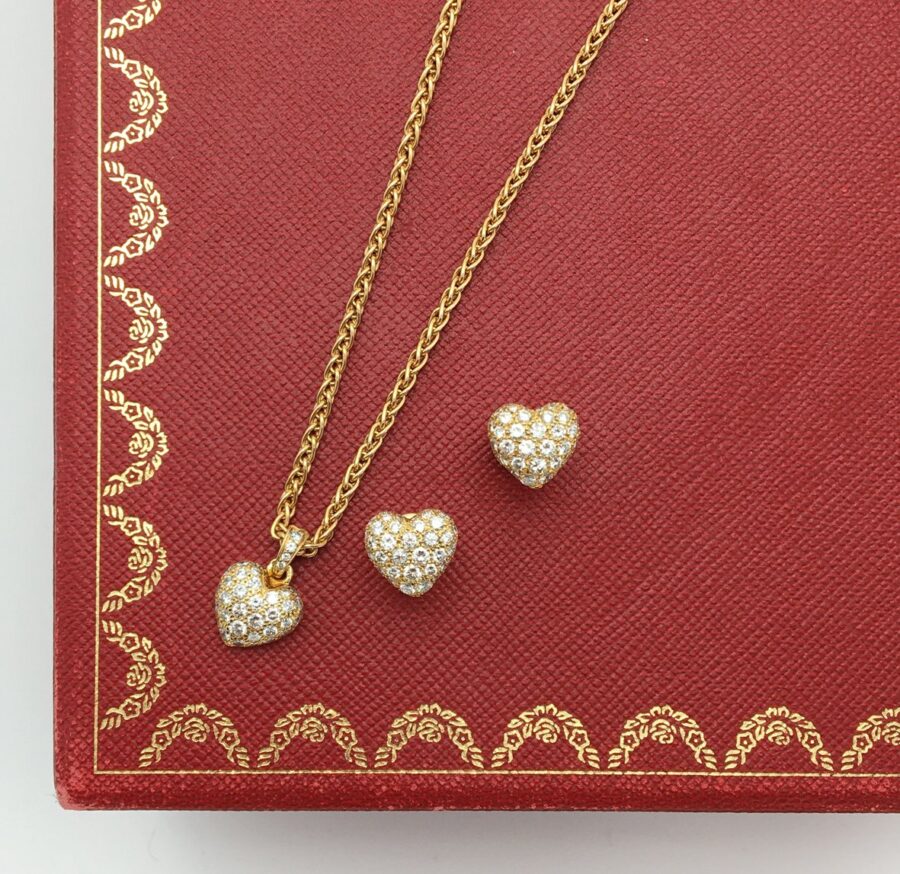 Cartier heart pendant on chain and stud earrings set with diamonds