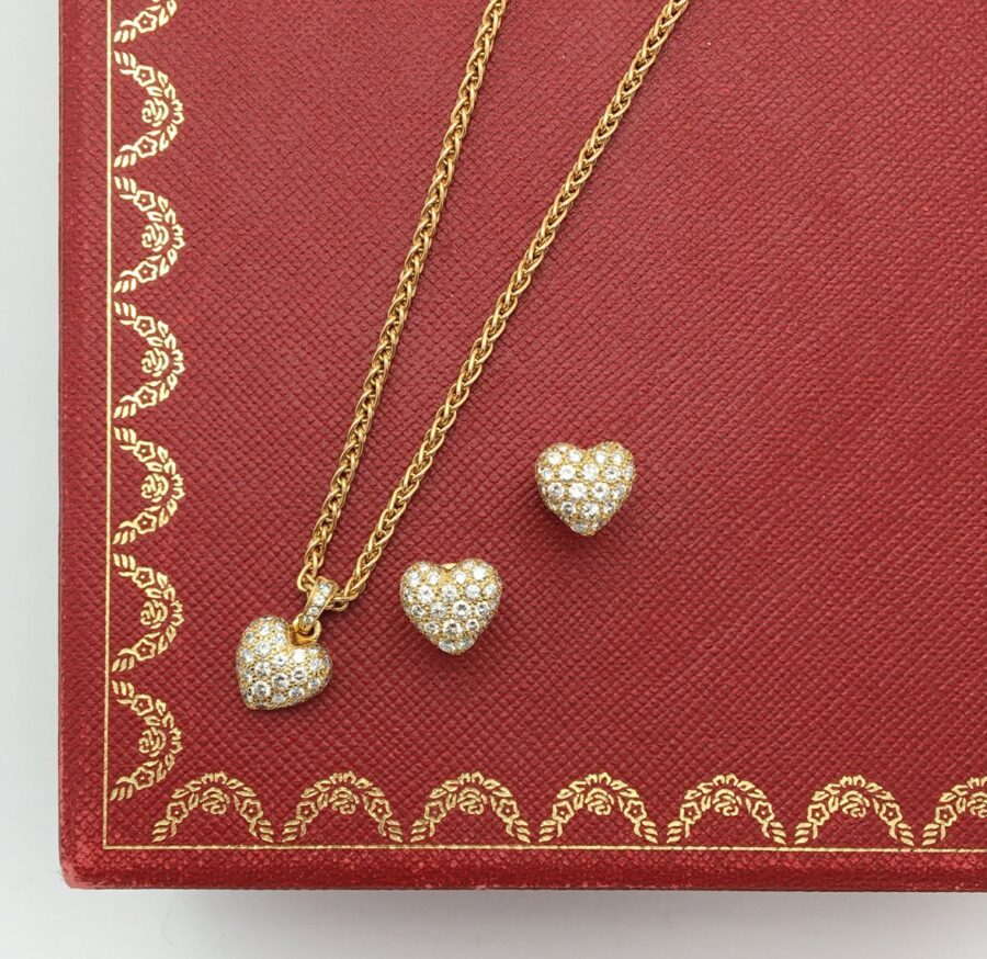 Cartier heart pendant on chain and stud earrings set with diamonds