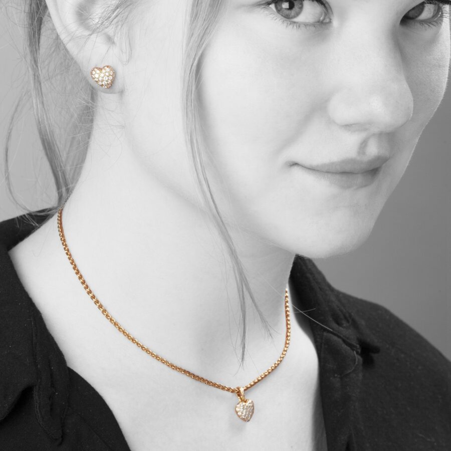 Cartier heart pendant on chain and stud earrings set with diamonds