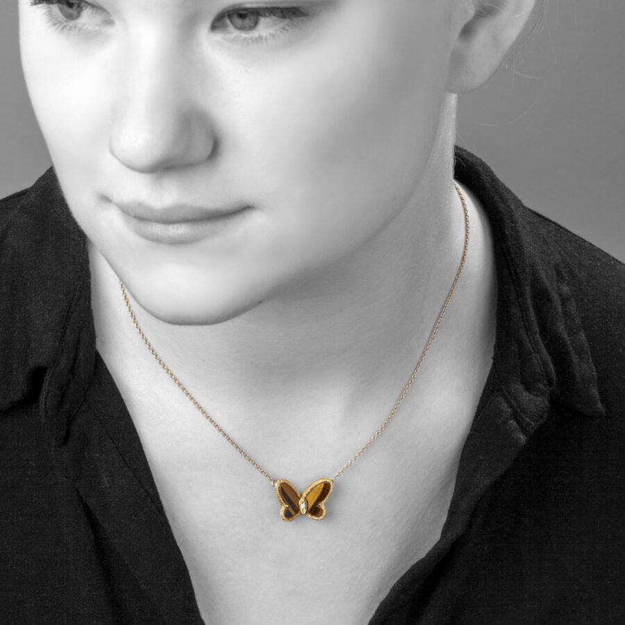 An eighteen carat yellow gold Sweet Alhambra Butterfly pendant necklace set with tiger's eye signed Van Cleef & Arpels, Paris, 1973