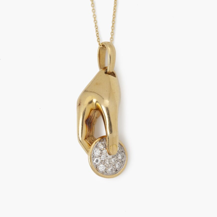 Cartier yellow gold hand pendant set with diamonds