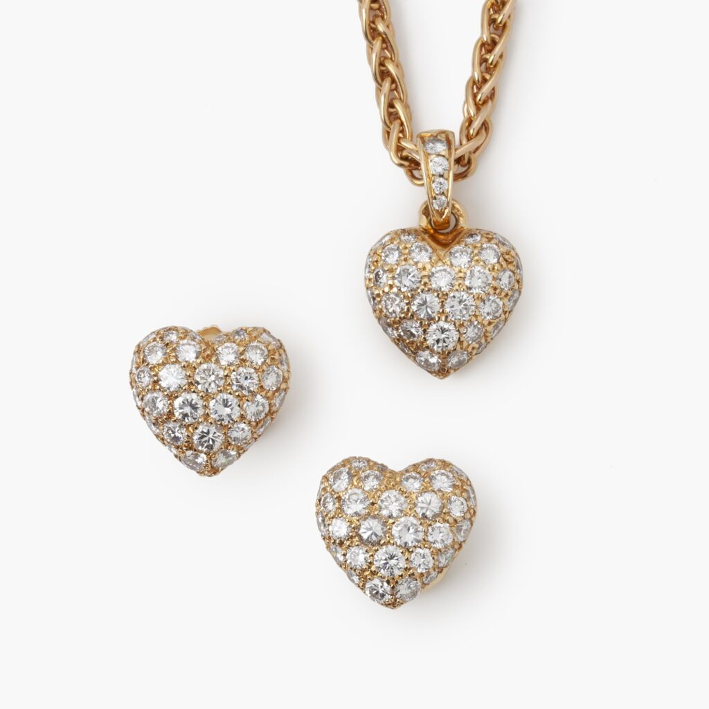 Cartier heart pendant on chain and stud earrings set with diamonds