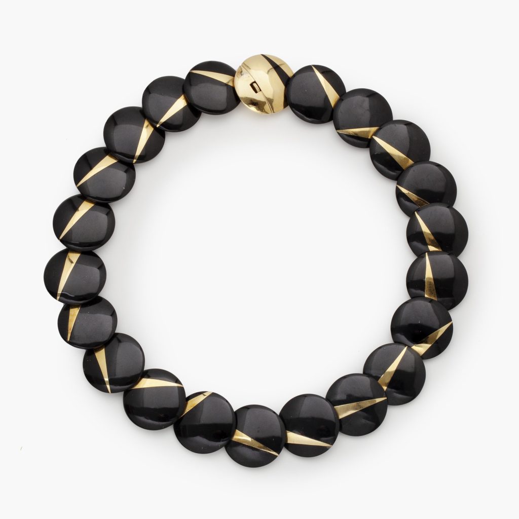 Onyx and yellow gold lentil necklace signed Tiffany & Co., after a design by Angela Cummings, ca 1980