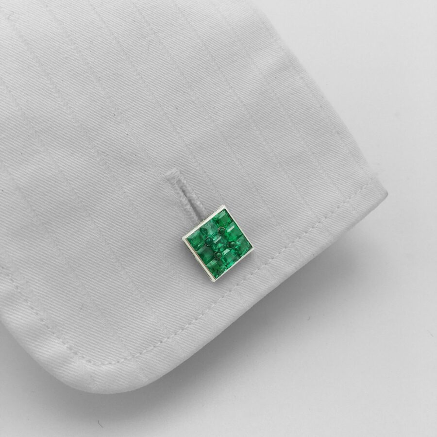 Platinum double emerald set cufflinks, made in France, ca 1950.