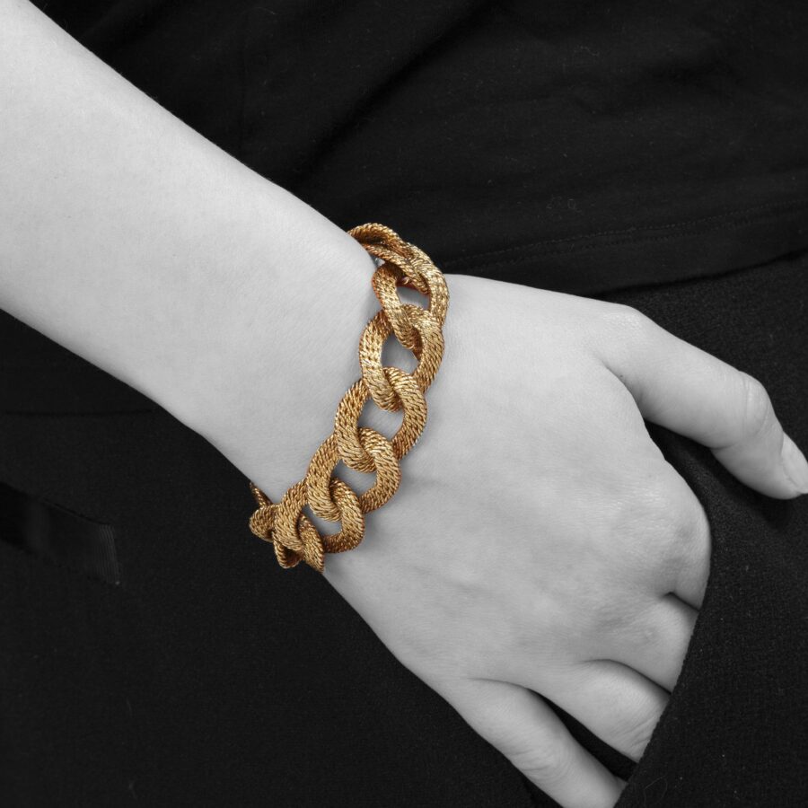 An eighteen carat yellow gold bracelet made of woven gold wire. Signed Van Cleef & Arpels, made in Paris, ca 1970. Made by Georges Lenfant, Paris.
