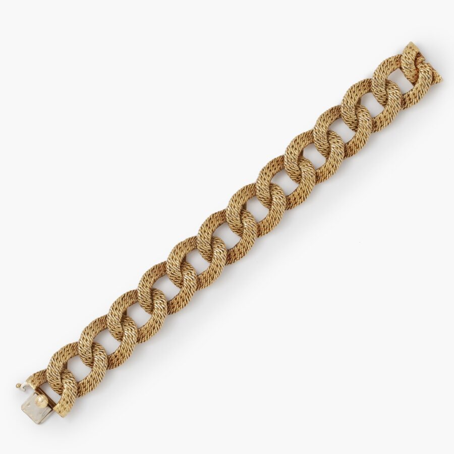 An eighteen carat yellow gold bracelet made of woven gold wire. Signed Van Cleef & Arpels, made in Paris, ca 1970. Made by Georges Lenfant, Paris.