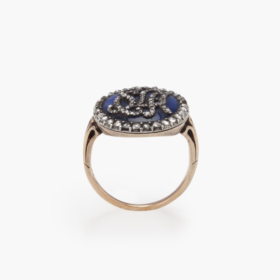 An antique rose gold and silver ring with blue enamel and diamonds, made ca 1880