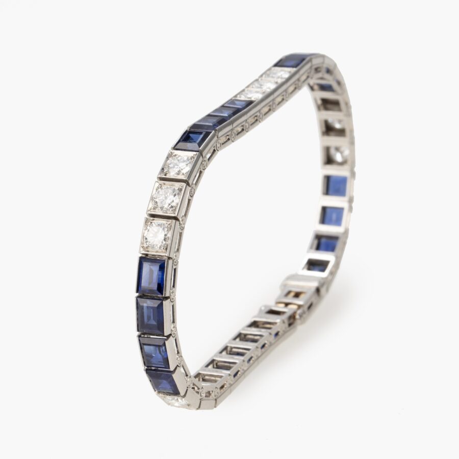 A platinum line bracelet set with sapphires and diamonds. Made in 1955 by Oscar Heyman. With certificate from Oscar Heyman, New York.