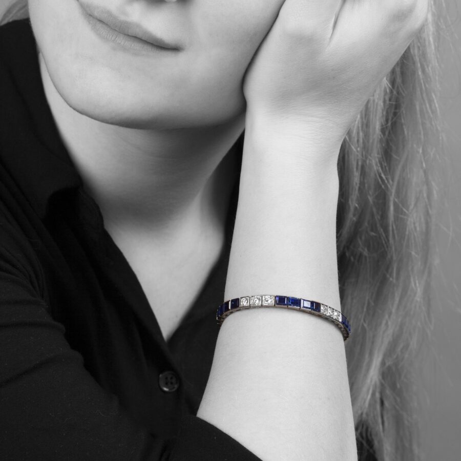 A platinum line bracelet set with sapphires and diamonds. Made in 1955 by Oscar Heyman. With certificate from Oscar Heyman, New York.