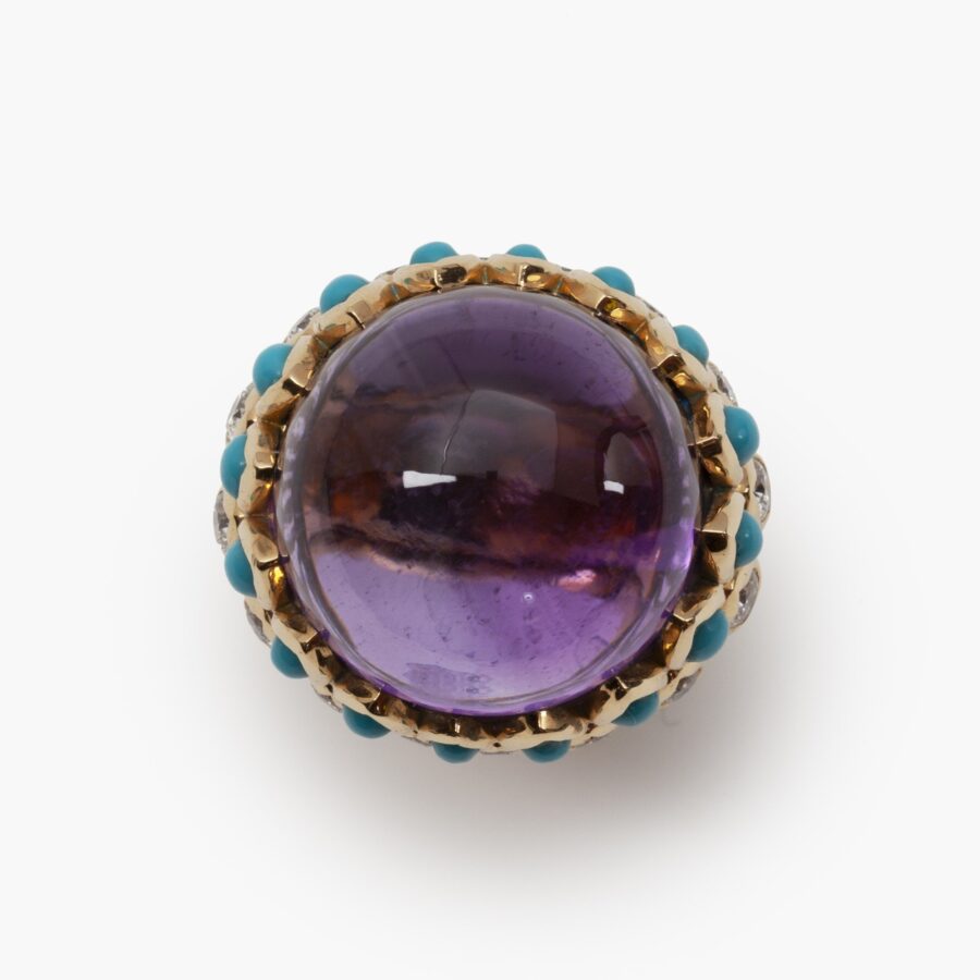 An eighteen carat yellow gold ring set with amethyst, turquoises and brilliant cut diamonds. Signed Cartier Paris, made ca 1960, and numbered. 