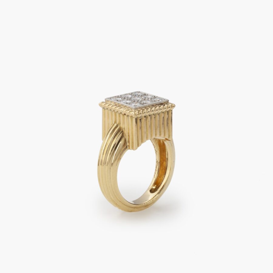 An eighteen carat yellow gold and platinum ring pavé set with brilliant cut diamonds. Signed Cartier Paris and numbered, made ca 1970.