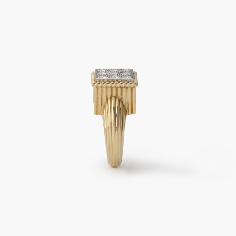 An eighteen carat yellow gold and platinum ring pavé set with brilliant cut diamonds. Signed Cartier Paris and numbered, made ca 1970.