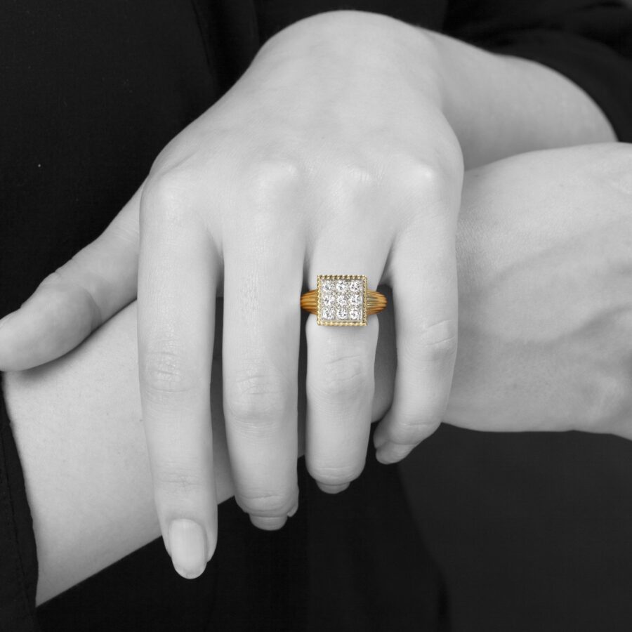 An eighteen carat yellow gold and platinum ring pavé set with brilliant cut diamonds. Signed Cartier Paris and numbered, made ca 1970.