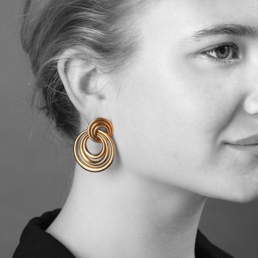A pair of eighteen carat yellow gold earrings made of many concentric rings. Signed Cartier and numbered, dated 1993.