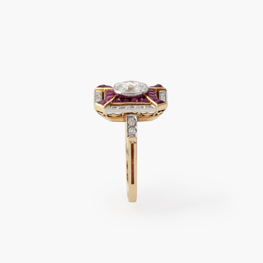 An eighteen carat yellow gold and platinum Art Deco ring, set with old brilliant cut diamonds and calibré cut rubies, made in France, ca 1910.