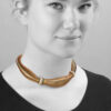 An eighteen carat yellow gold necklace, set with diamonds and emeralds. Signed Cartier and numbered. Made in Italy, ca 1965. With IAJA certificate.