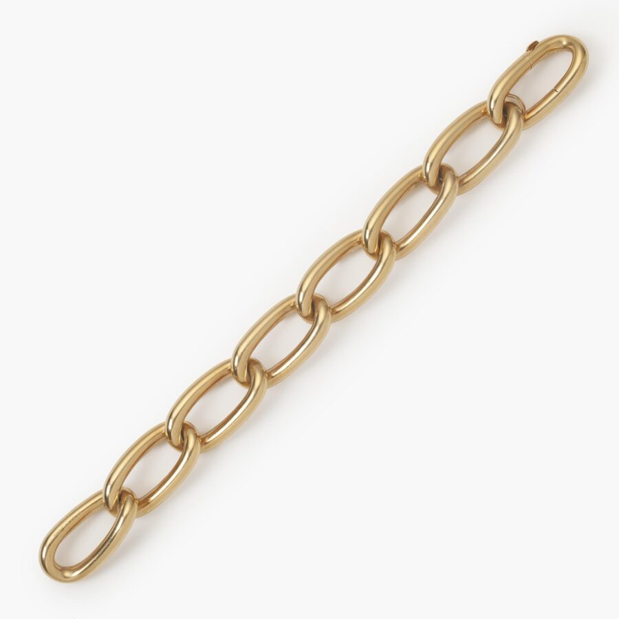 An eighteen carat yellow gold curb chain bracelet comprising eight elongated links with a spring clasp with safeguard. Signed Cartier Paris. 