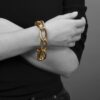 An eighteen carat yellow gold curb chain bracelet comprising eight elongated links with a spring clasp with safeguard. Signed Cartier Paris. 