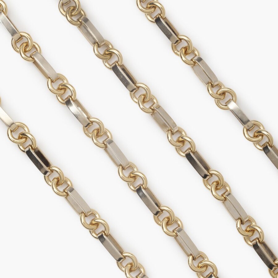 An eighteen carat yellow- and white gold longchain, on a white gold flat lobster claw. Signed Van Cleef & Arpels and numbered.