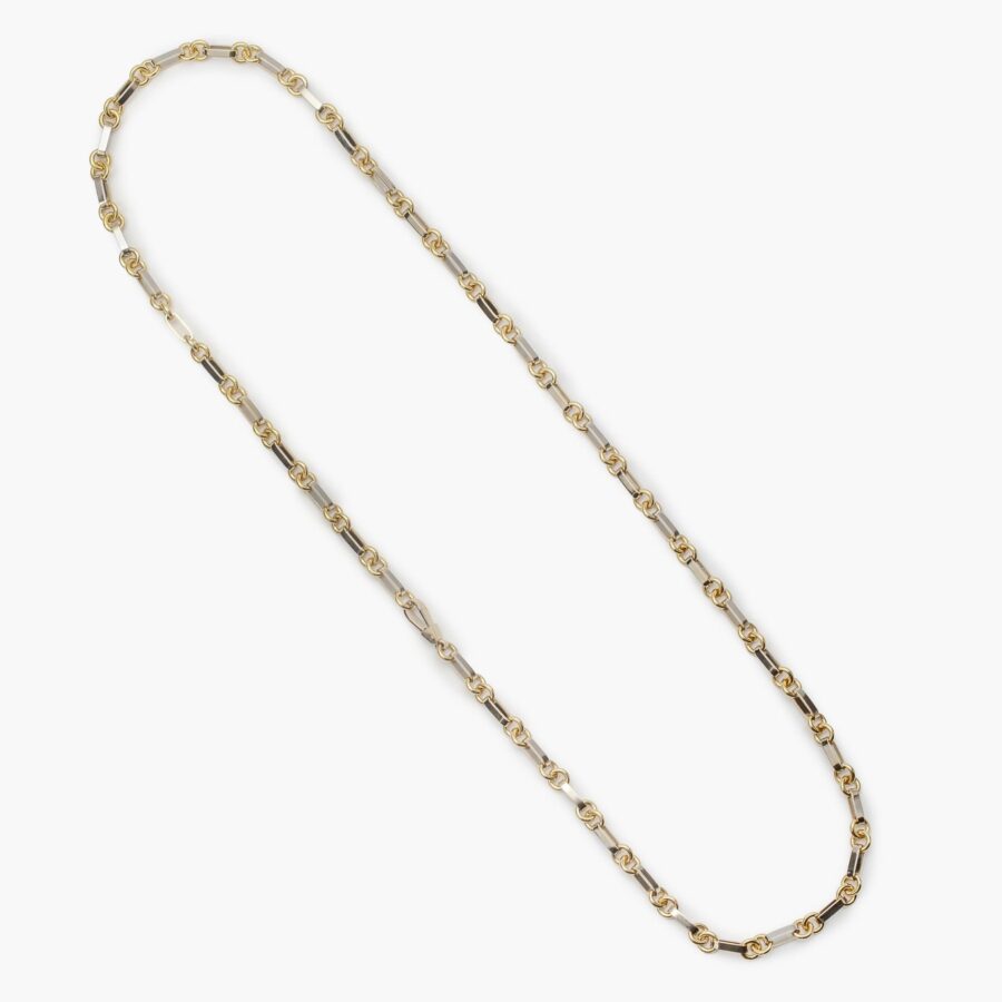 An eighteen carat yellow- and white gold longchain, on a white gold flat lobster claw. Signed Van Cleef & Arpels and numbered.