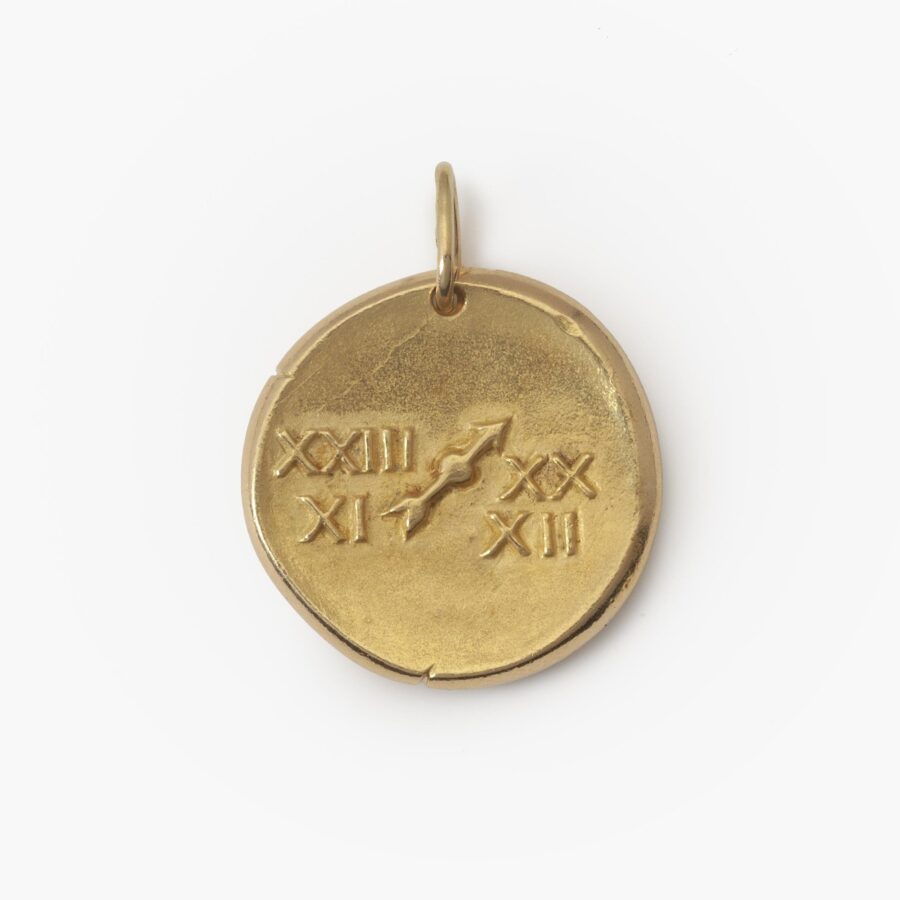 An eighteen carat yellow gold round pendant with the zodiac sign sagittarius. Signed Van Cleef & Arpels, Paris, ca 1970. Made byf Georges Lenfant, Paris.
