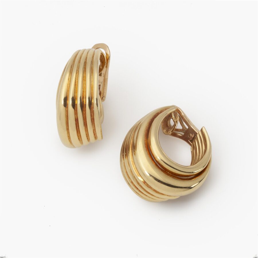 A pair of eighteen carat yellow gold clip earrings. Signed Van Cleef & Arpels, and numbered. Made in Paris, ca 1990. With maker’s mark of A. Vassort, Paris.