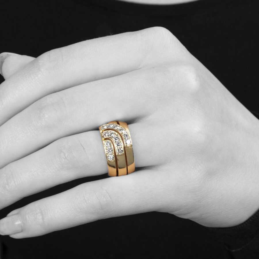 An eighteen carat yellow gold ring set with brilliant cut diamonds. Signed Cartier London, dateletter for 1989 and numbered. With original box.