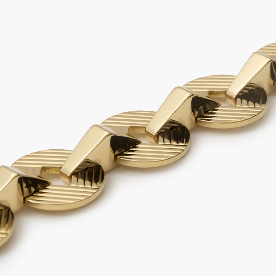 An eighteen carat yellow gold bracelet made of eight round and eight triangular links. Signed Cartier, London and numbered. Dated 1959.