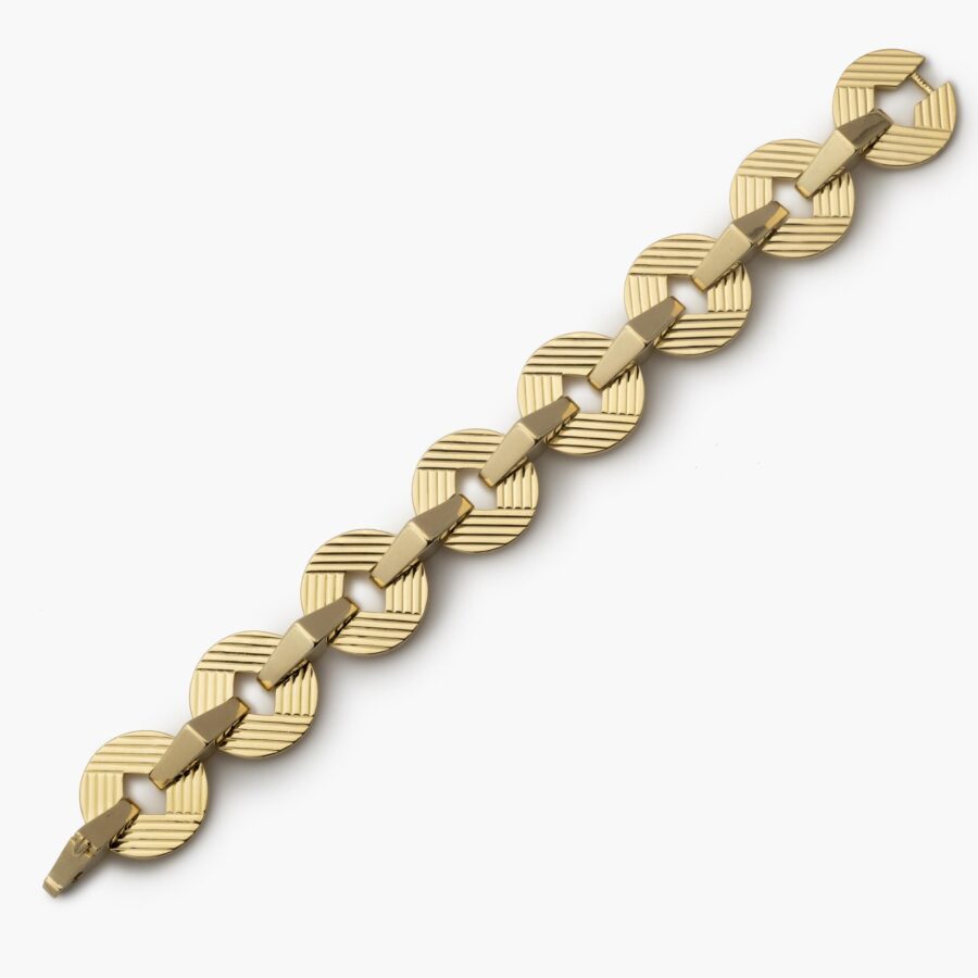 An eighteen carat yellow gold bracelet made of eight round and eight triangular links. Signed Cartier, London and numbered. Dated 1959.