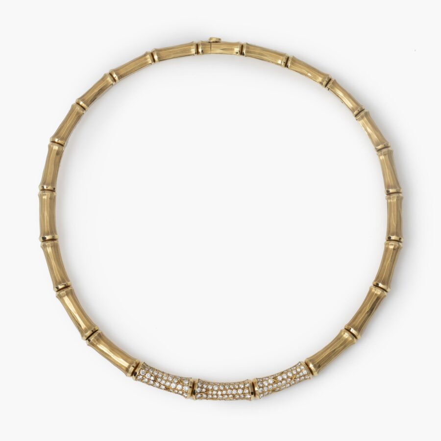 An eighteen carat yellow gold ´Bamboo´ necklace, the central three segments pavé set with brilliant cut diamonds. Signed Cartier and numbered.