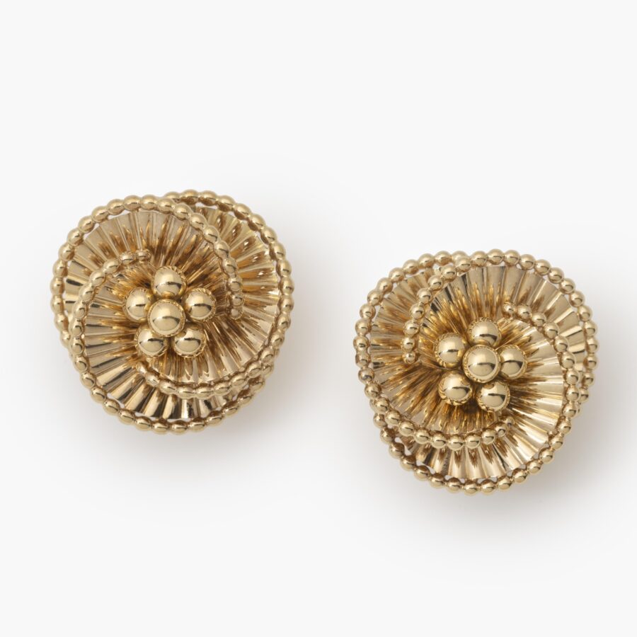 A pair of eighteen carat yellow gold tourbillon earrings designed as three intertwined ribbed ribbonss. Signed Cartier Paris, ca 1950. In original case.