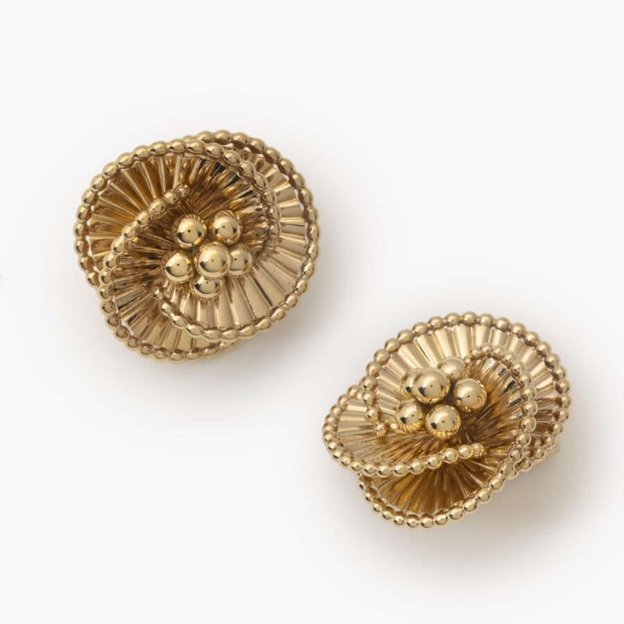 A pair of eighteen carat yellow gold tourbillon earrings designed as three intertwined ribbed ribbonss. Signed Cartier Paris, ca 1950. In original case.