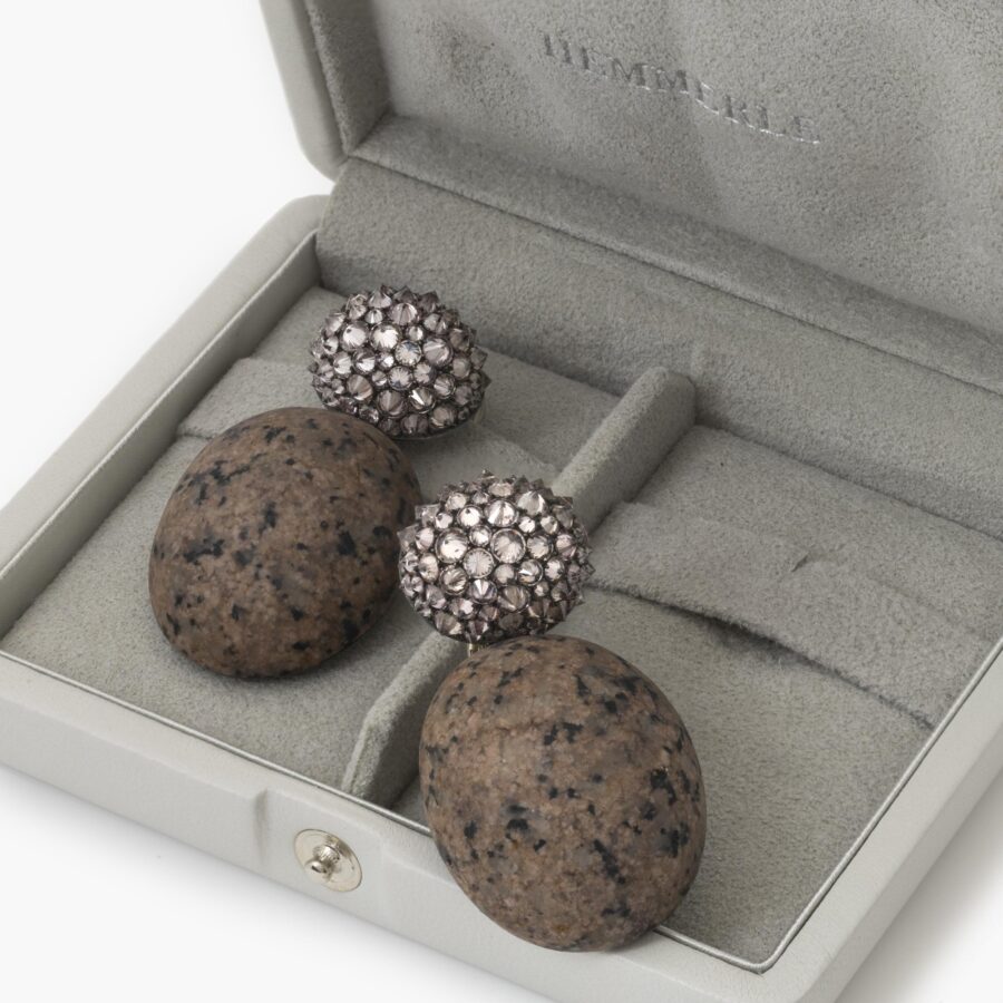 A pair of eighteen carat white gold and silver earrings set with very light pink diamonds and pink granite. Signed Hemmerle, Munich. In original case.