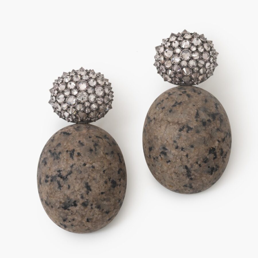 A pair of eighteen carat white gold and silver earrings set with very light pink diamonds and pink granite. Signed Hemmerle, Munich. In original case.