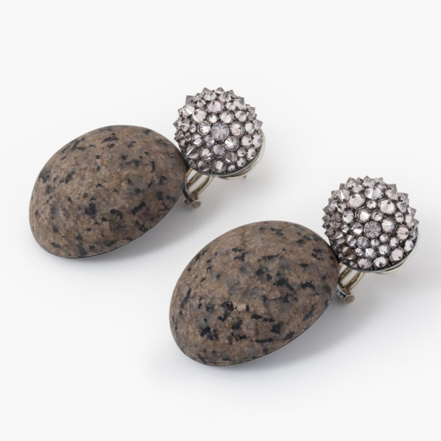 A pair of eighteen carat white gold and silver earrings set with very light pink diamonds and pink granite. Signed Hemmerle, Munich. In original case.