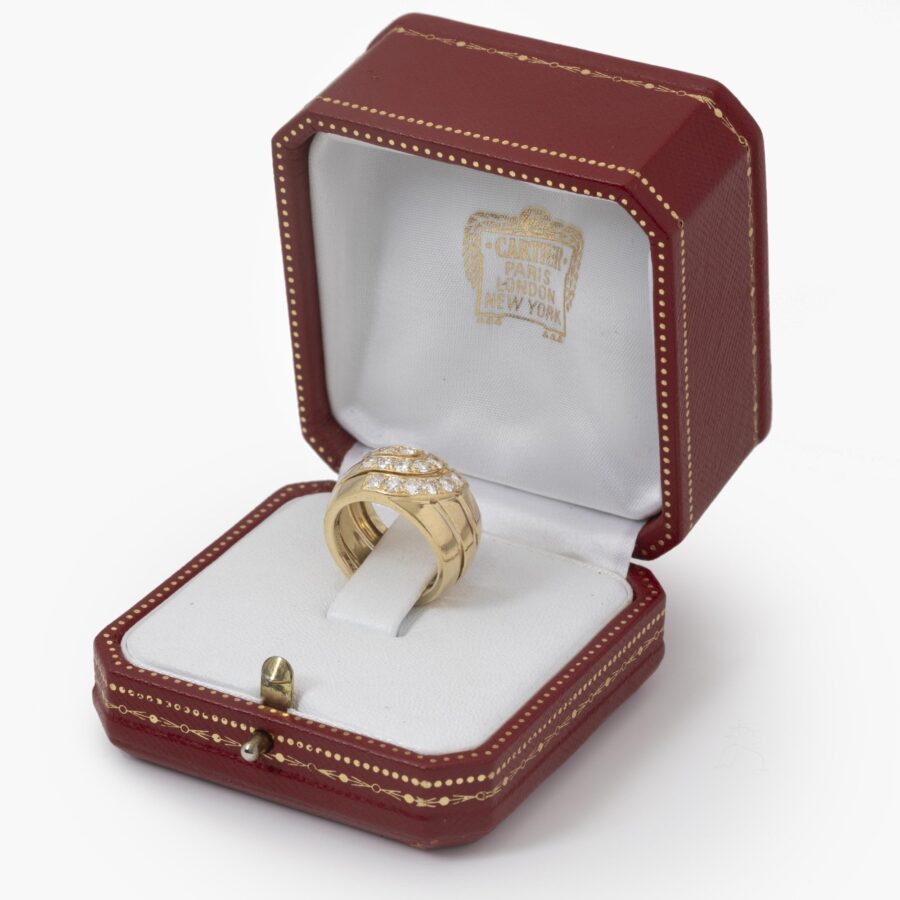 An eighteen carat yellow gold ring set with brilliant cut diamonds. Signed Cartier London, dateletter for 1989 and numbered. With original box.