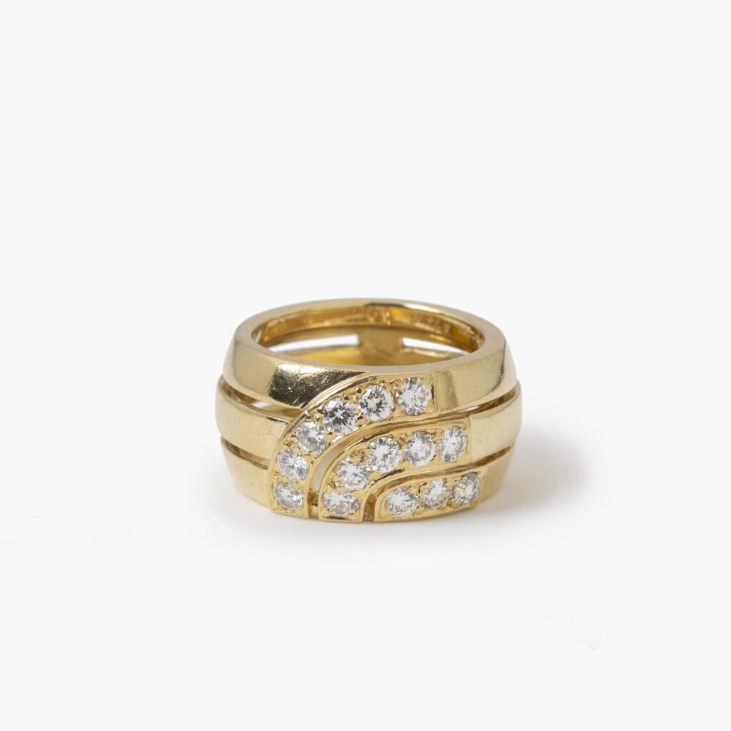 An eighteen carat yellow gold ring set with brilliant cut diamonds. Signed Cartier London, dateletter for 1989 and numbered. With original box.