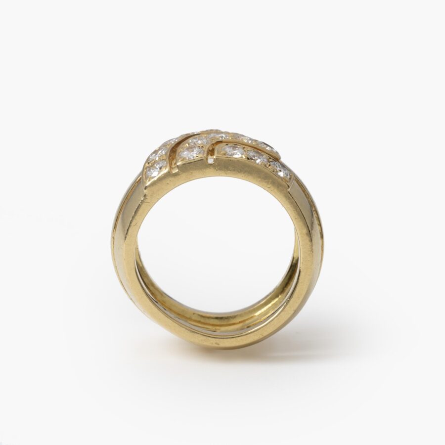 An eighteen carat yellow gold ring set with brilliant cut diamonds. Signed Cartier London, dateletter for 1989 and numbered. With original box.