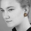 A pair of eighteen carat red gold and copper oval bombé clip earrings, pavé set with brilliant cut brown diamonds. Signed Hemmerle, made in Munich.