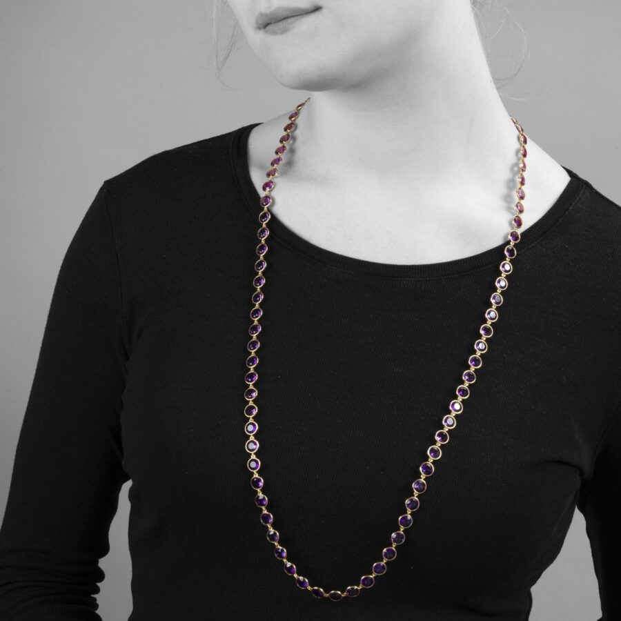 An eighteen carat yellow gold longchain designed as 80 round facetted amethysts in spectacle-mounts. Signed Van Cleef & Arpels, France, made in 1983. 
