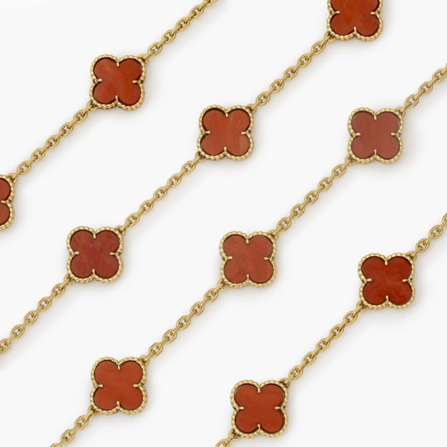 An eighteen carat yellow gold “Alhambra” longchain made of twenty coral “Alhambra” motifs. Signed Van Cleef & Arpels and numbered, made in Paris in 1977.