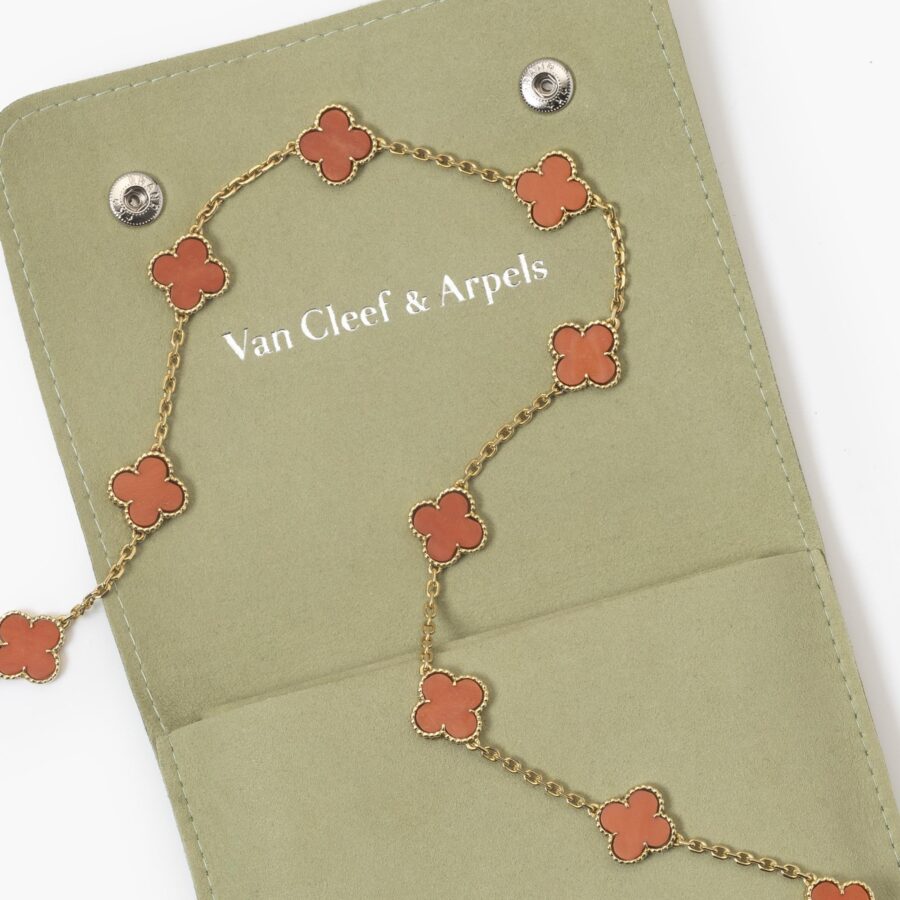An eighteen carat yellow gold “Alhambra” longchain made of twenty coral “Alhambra” motifs. Signed Van Cleef & Arpels and numbered, made in Paris in 1977.