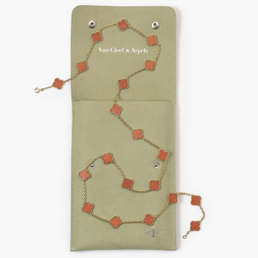 An eighteen carat yellow gold “Alhambra” longchain made of twenty coral “Alhambra” motifs. Signed Van Cleef & Arpels and numbered, made in Paris in 1977.