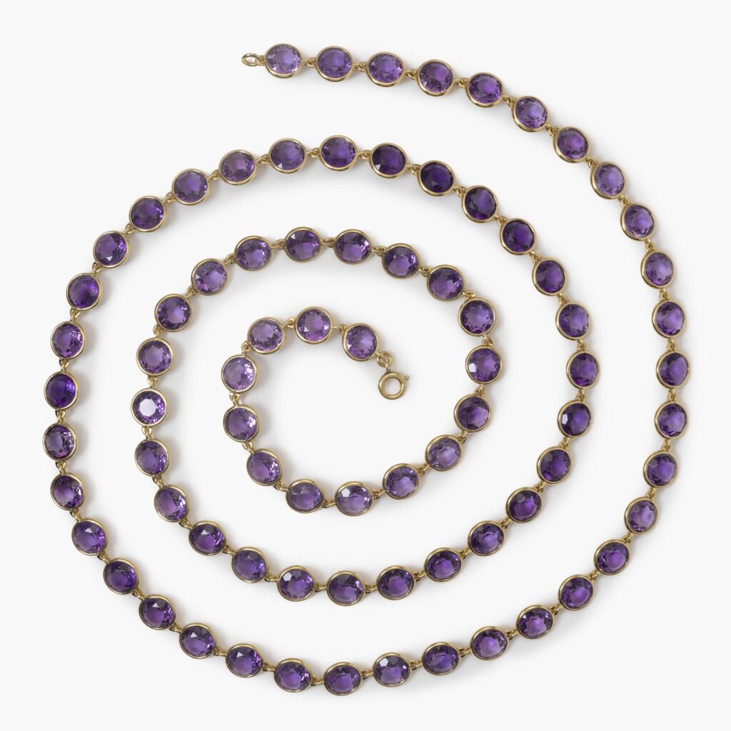 An eighteen carat yellow gold longchain designed as 80 round facetted amethysts in spectacle-mounts. Signed Van Cleef & Arpels, France, made in 1983. 