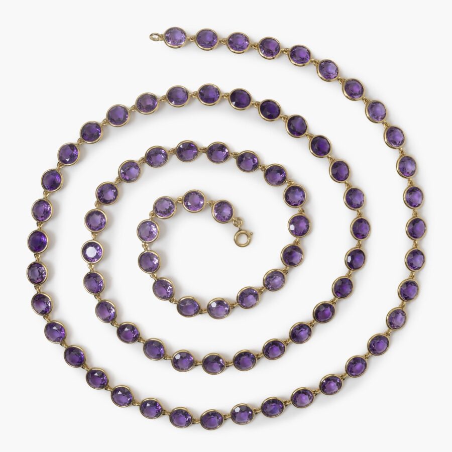 An eighteen carat yellow gold longchain designed as 80 round facetted amethysts in spectacle-mounts. Signed Van Cleef & Arpels, France, made in 1983. 