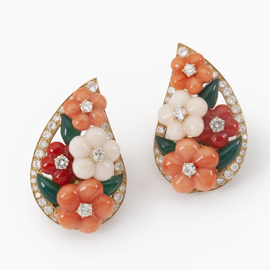 A pair of eighteen carat yellow gold clip earrings and matching ring, all set with coral, diamonds and green agate, signed Van Cleef & Arpels, Paris.