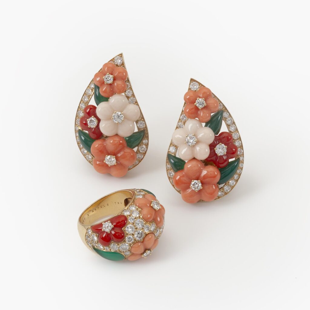 A pair of eighteen carat yellow gold clip earrings and matching ring, all set with coral, diamonds and green agate, signed Van Cleef & Arpels, Paris.
