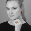 A pair of eighteen carat yellow gold clip earrings and matching ring, all set with coral, diamonds and green agate, signed Van Cleef & Arpels, Paris.