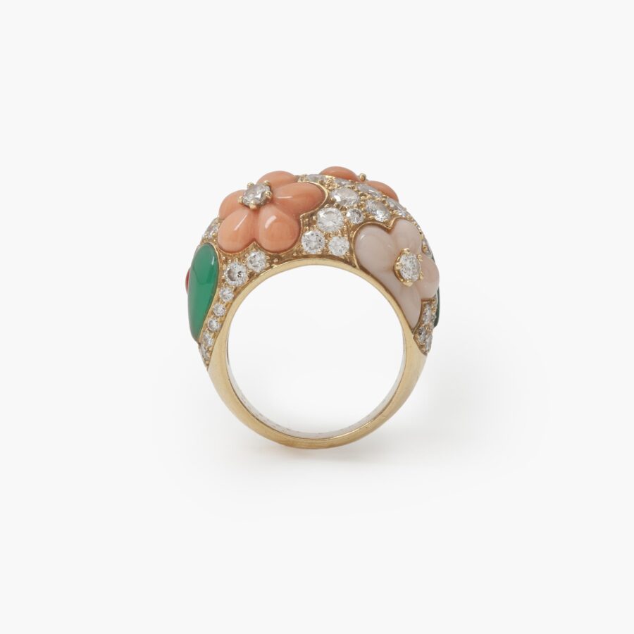 A pair of eighteen carat yellow gold clip earrings and matching ring, all set with coral, diamonds and green agate, signed Van Cleef & Arpels, Paris.