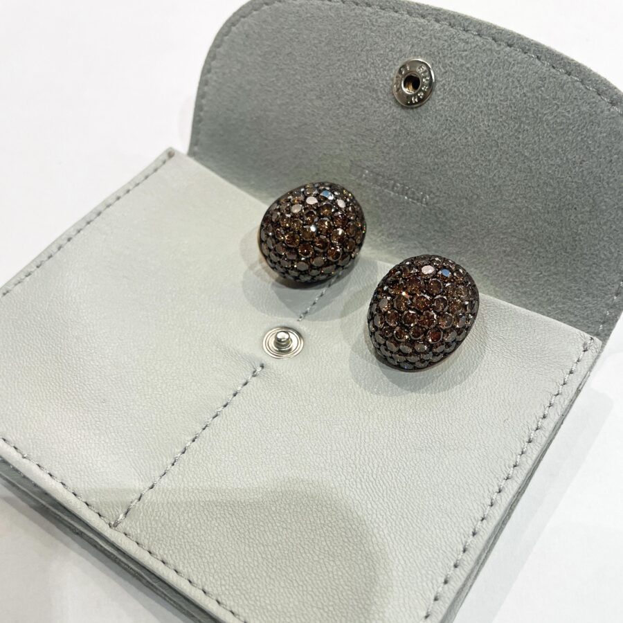 A pair of eighteen carat red gold and copper oval bombé clip earrings, pavé set with brilliant cut brown diamonds. Signed Hemmerle, made in Munich.
